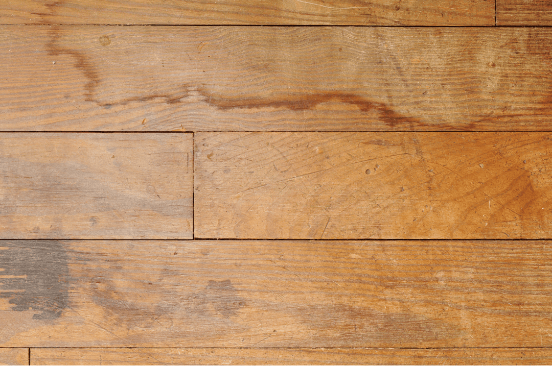 Hardwood flooring planks showing water damage